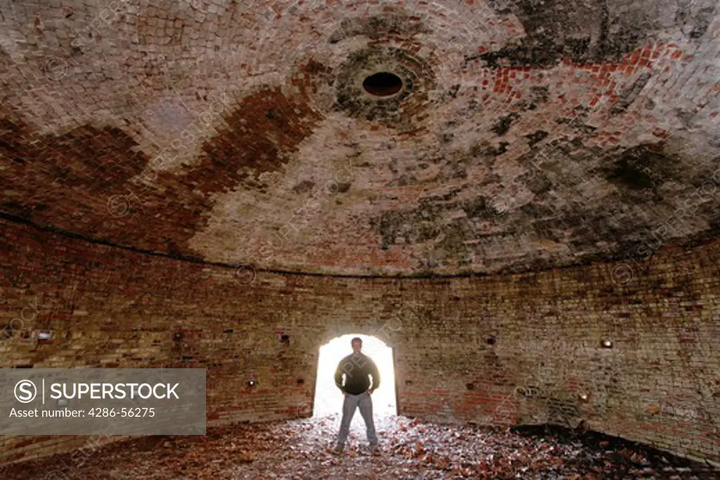 Man standing in old coke oven