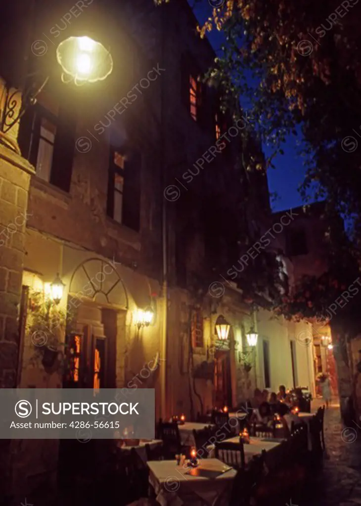 Typical Venetian Alleyway and Restaurants at night in Chania Old Town.