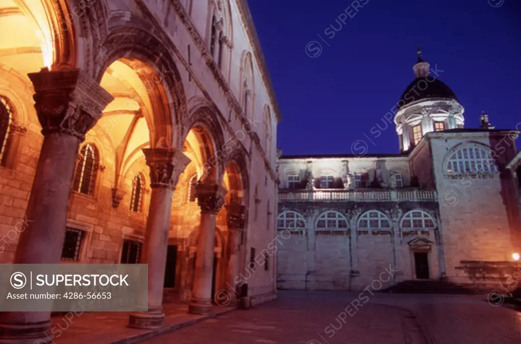 The Rectors Palace and Cathedral of the Assumption of the Virgin Mary, illuminated at night. Dubrovnik Old Town. Croatia.