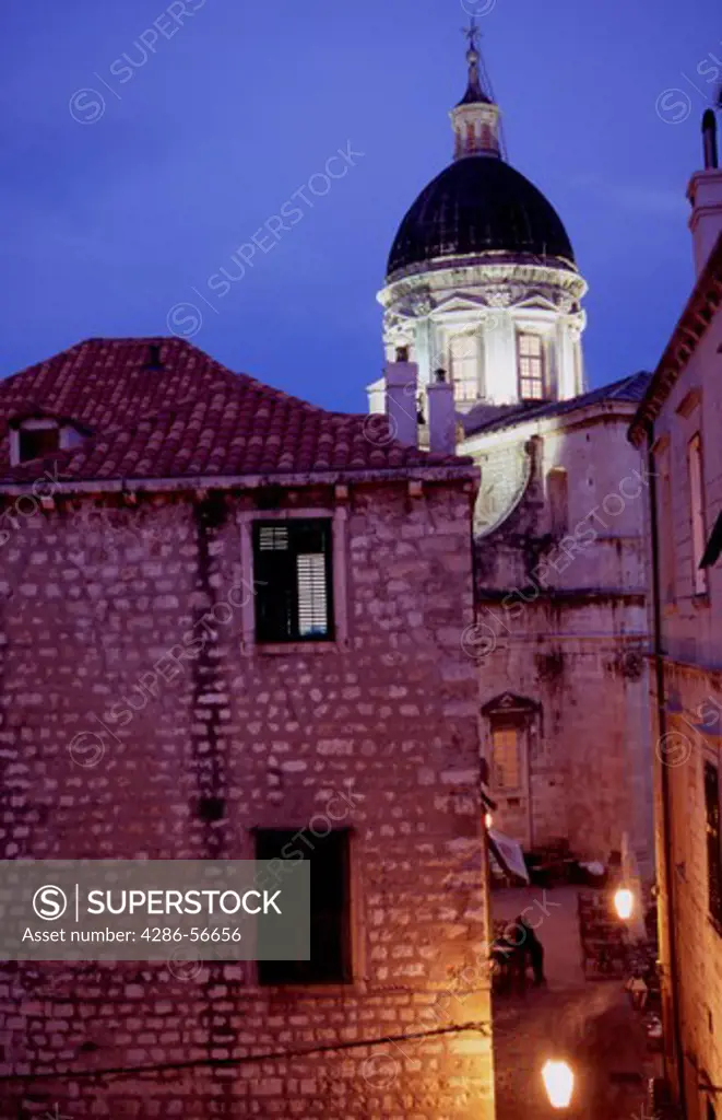 Illuminated alleyway and Cathedral Dome at night.Dubrovnik Old Town. Croatia.