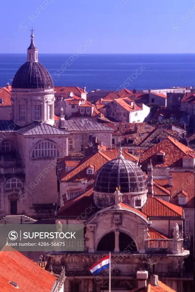 Croatia. Dubrovnik. Terracota roof tiles of the old city, The Cathedral, and St Blaise Church.