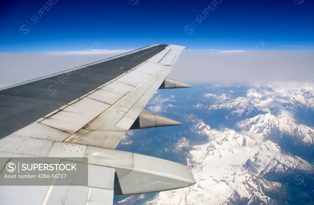 View of the French Alps from passenger jet window.