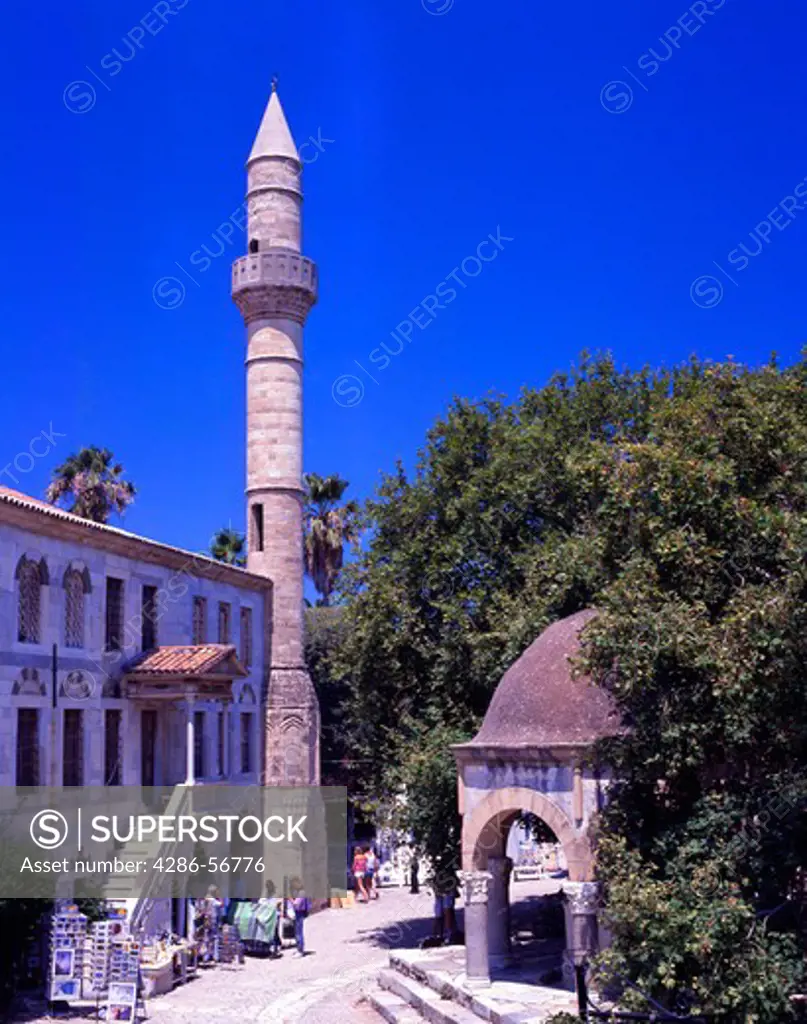 Greece. Logia Mosque of Hassan Pasha, Ottoman fountain and Hippocrates Plane Tree. Plateia Platinou. Kos. Greek Dodecanese Islands.