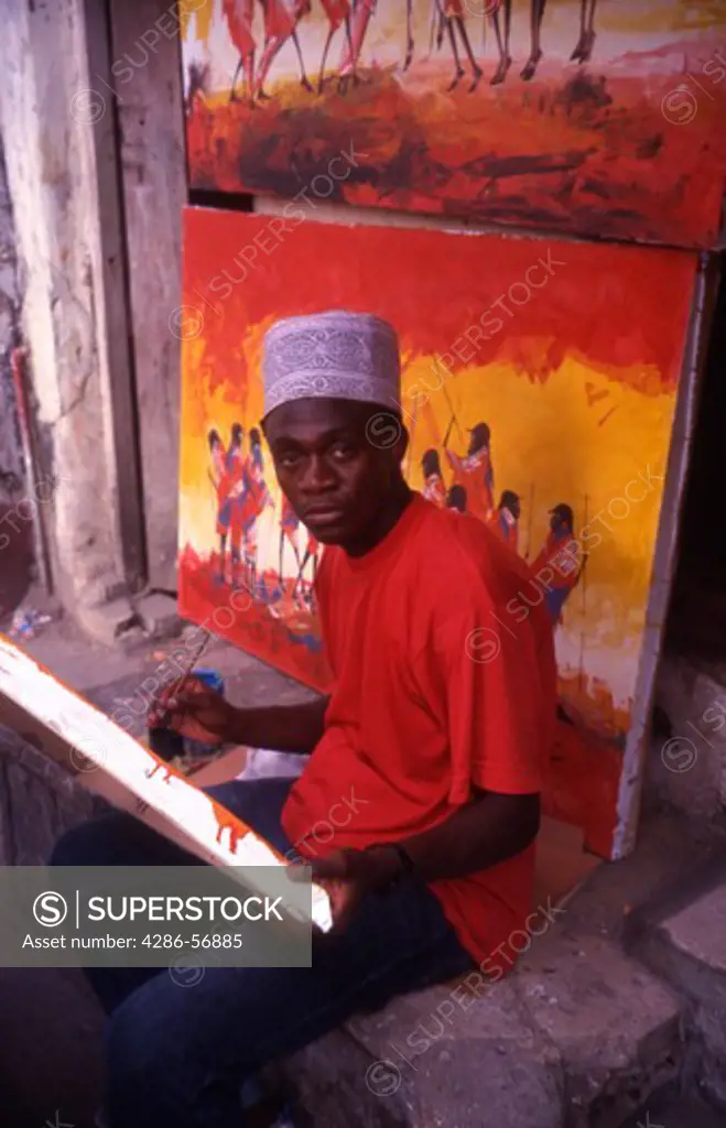 Zanzibar. A painter at work in Stone Town.