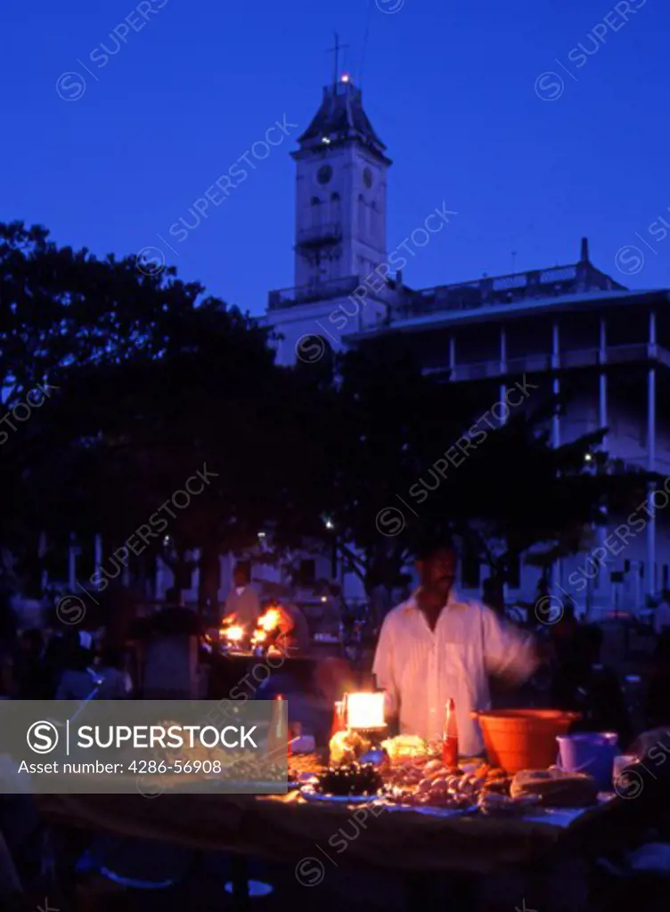 Food and drinks stalls in Forodhani Gardens. Early evening.The House of Wonders in the background. Stone Town. Zanzibar. Tanzania.