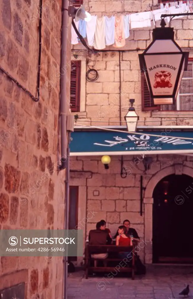 Croatia. Dubrovnik Old City. People sat outside a restaurant.