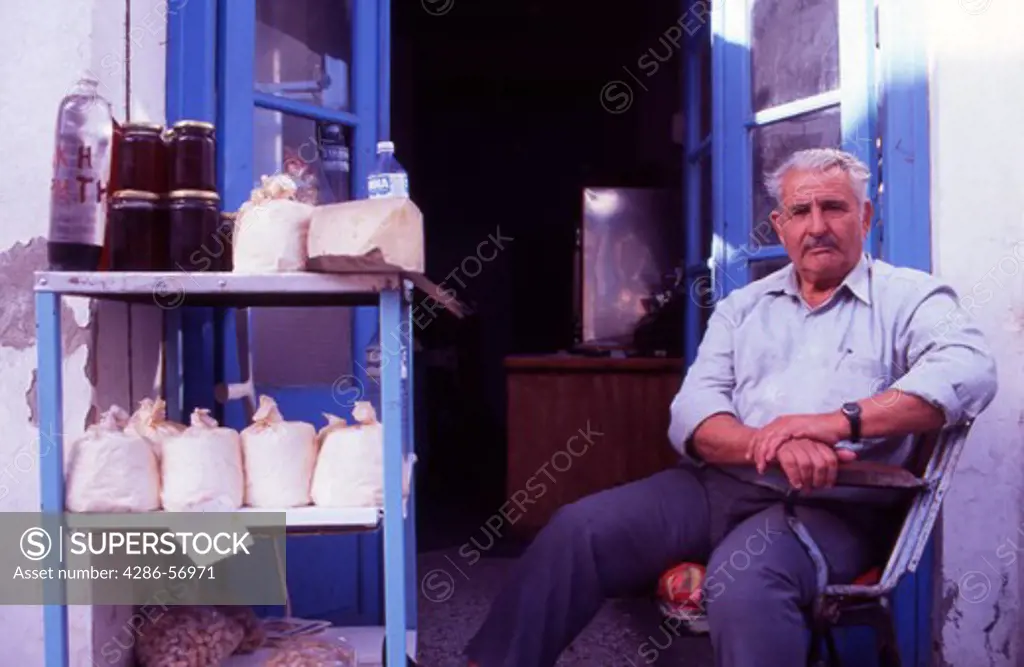 Greece. Western Crete. Local Produce. Cheeses, Honey, Sultanas, and Raki ( Tsikoudhia ) for sale in Rethymnon Old Town. Model Released