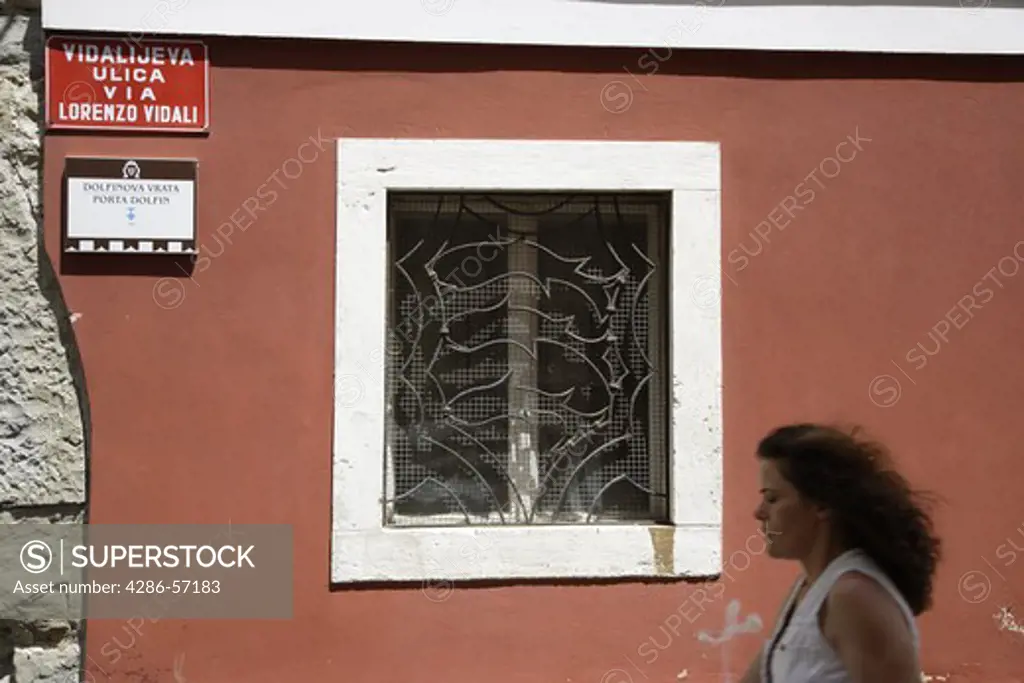 Slovenia. Piran. Venetian House with metal Dolphin motif window