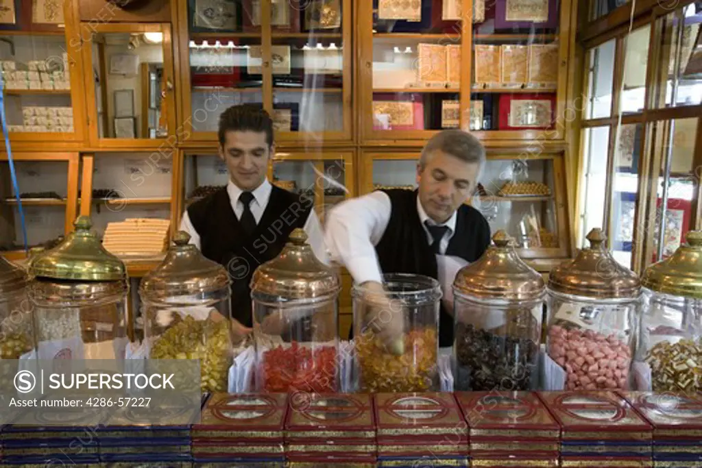 Serving sweets inside the Haci Bekir shop in Istanbul, Turkey. MR and Property Released