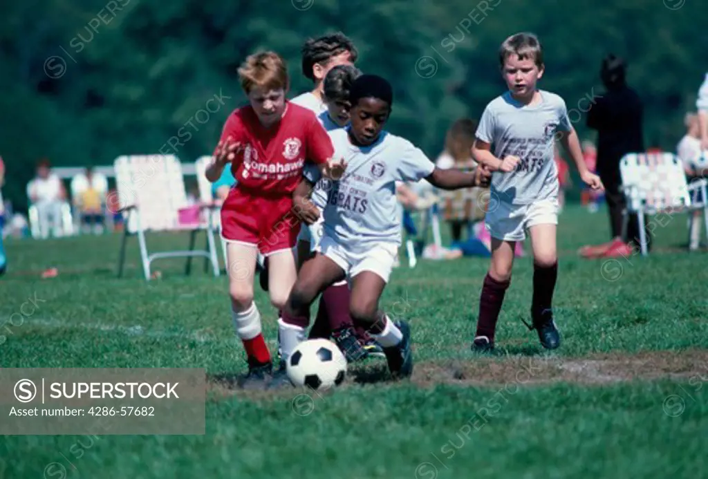 Young boys of mixed ethnicity participating in YMCA youth soccer in Springfield, IL.