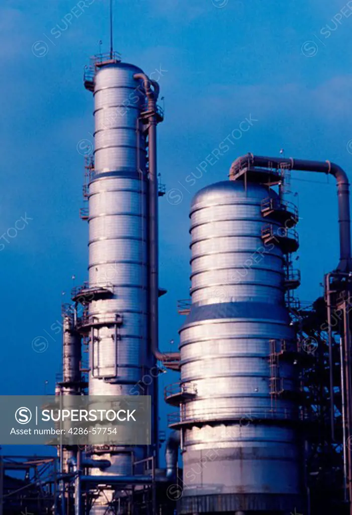 Clear, blue sky daytime picture of a petroleum oil refinery, U.S.A..