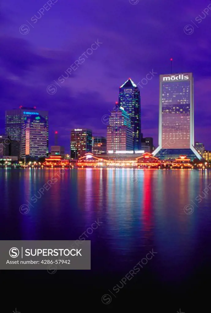 The lights of the downtown Jacksonville, Florida skyline reflected on the water.  The view is looking due North of the Saint Johns River into downtown.