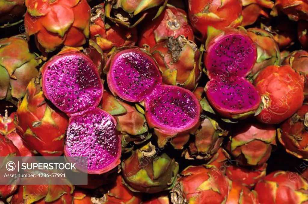 Creating a riot of color, a basket of Pitaya or Strawberry Pear fruit, is displayed in an open air market in Guatemala City, Guatemala, Central America