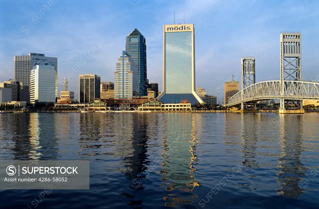 Late afternoon sunlight reflects in St. Johns River from Jacksonville, Florida, skyline