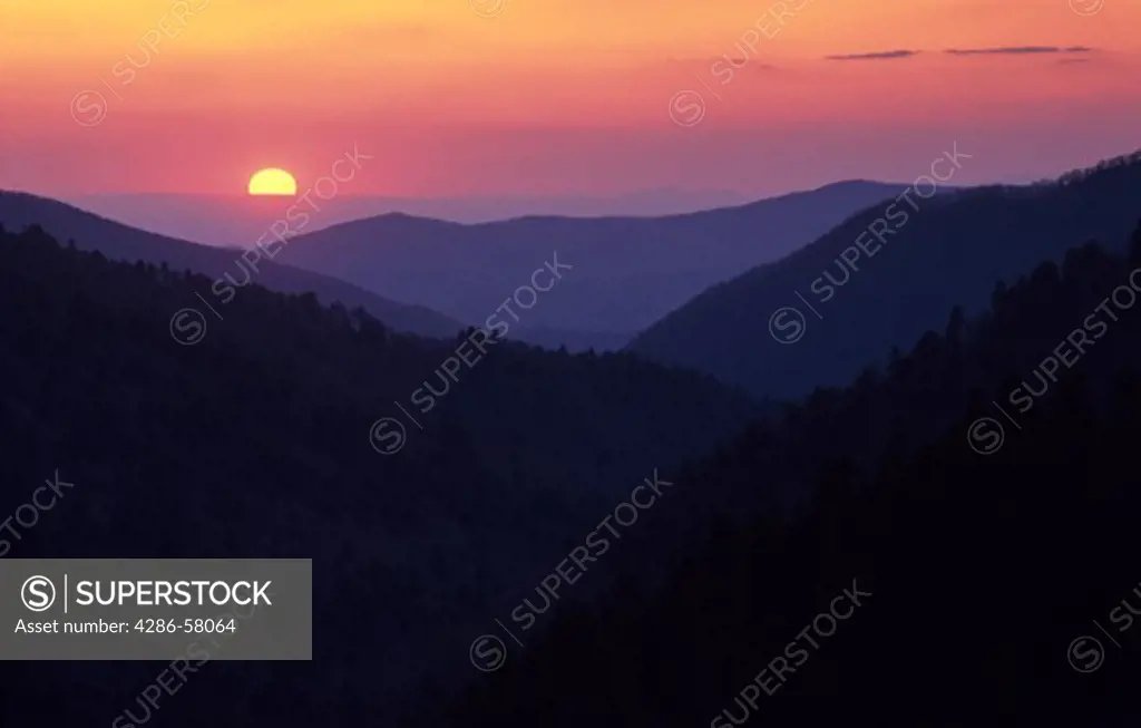 Sun sets behind hazy ridge lines, Great Smoky Mountians National Park, North Carolina