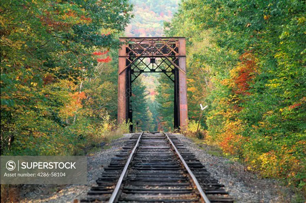 Fall colors surround rail road and bridge, New Hampshire, White Mountain National Forest, New Hampshire  Fall colors surround rail road and bridge, New Hampshire, White Mountain National Forest, New Hampshire