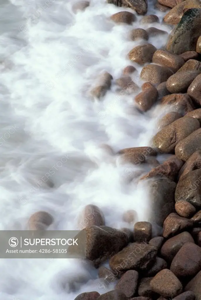 Waves wash against time worn boulders along Atlantic coast, Acadia National Park, Bar Harbor, Maine  Waves wash against time worn boulders along Atlantic coast, Acadia National Park, Bar Harbor, Maine