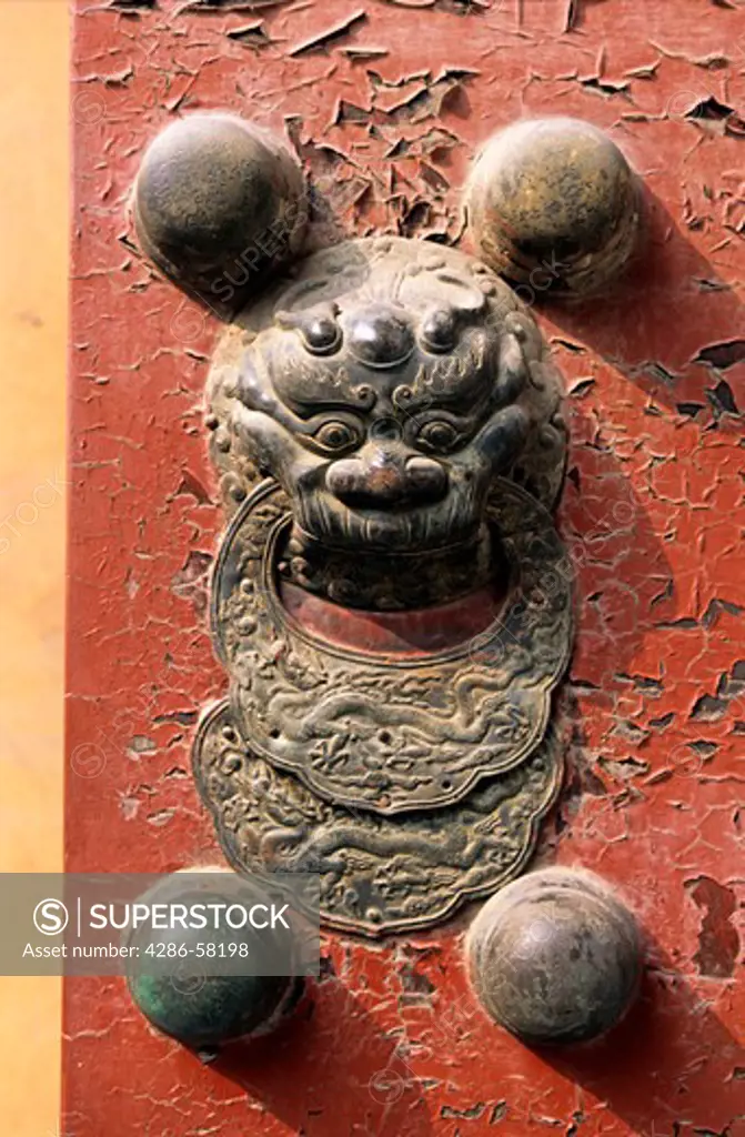Fierce mythical beast adorns gate to the Forbidden City, Beijing, China