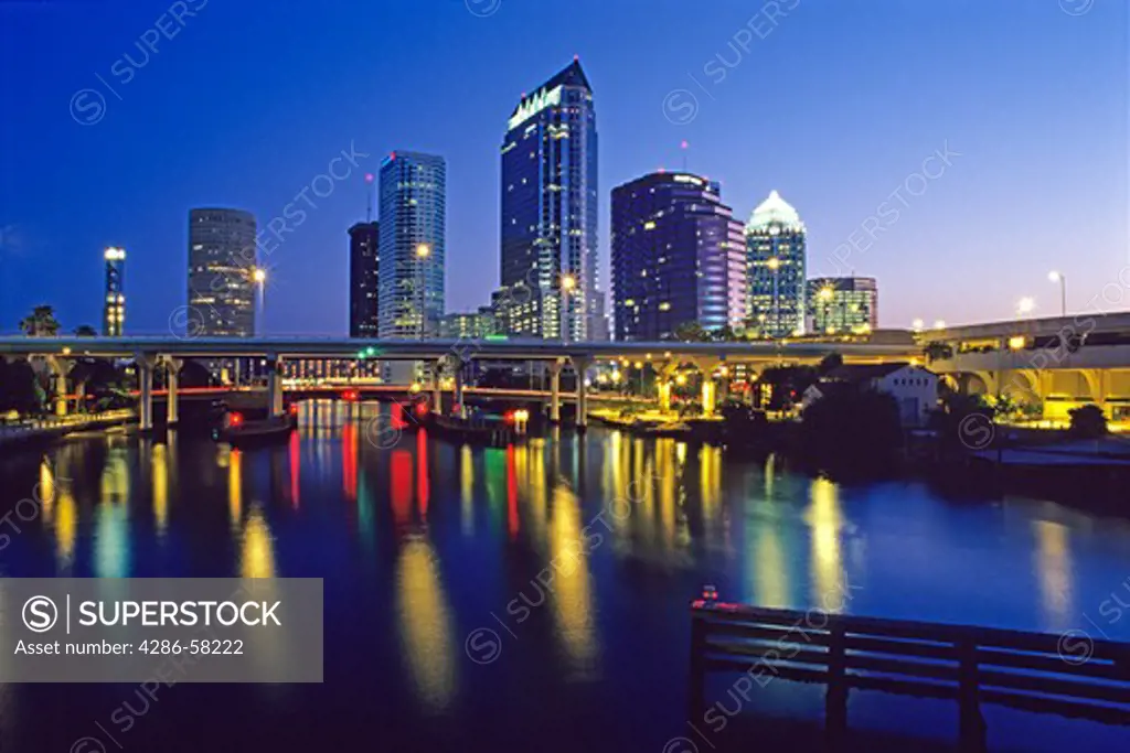 Downtown Tampa, FL, reflected in Hillsborough River at dawn.