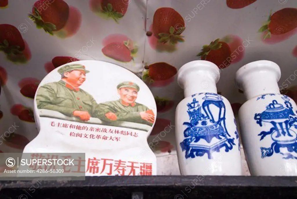 Tiny tourist shop in Qingkou Village displays decorative item depicting Mao Zedong, left, and Zhu De, army leader, Yuanyan County, Yunnan Province, China.