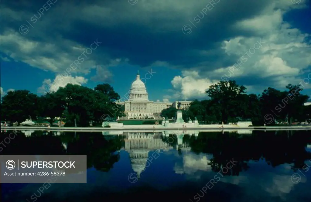 The Capitol reflecting in pond, Washington, DC, USA.