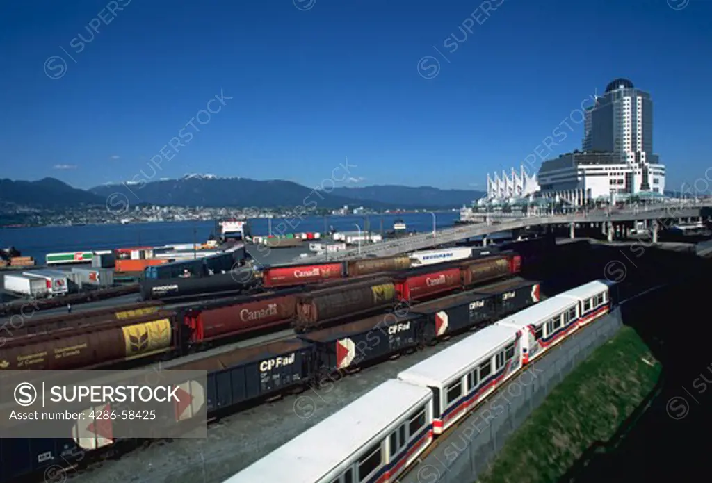 Railcars and the Skytrain at CPR Pier A, Canada Place, Vancouver, British Columbia.