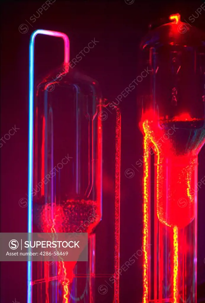 A chemistry model used in petroleum refining illuminated in bright magenta, yellow and blue.
