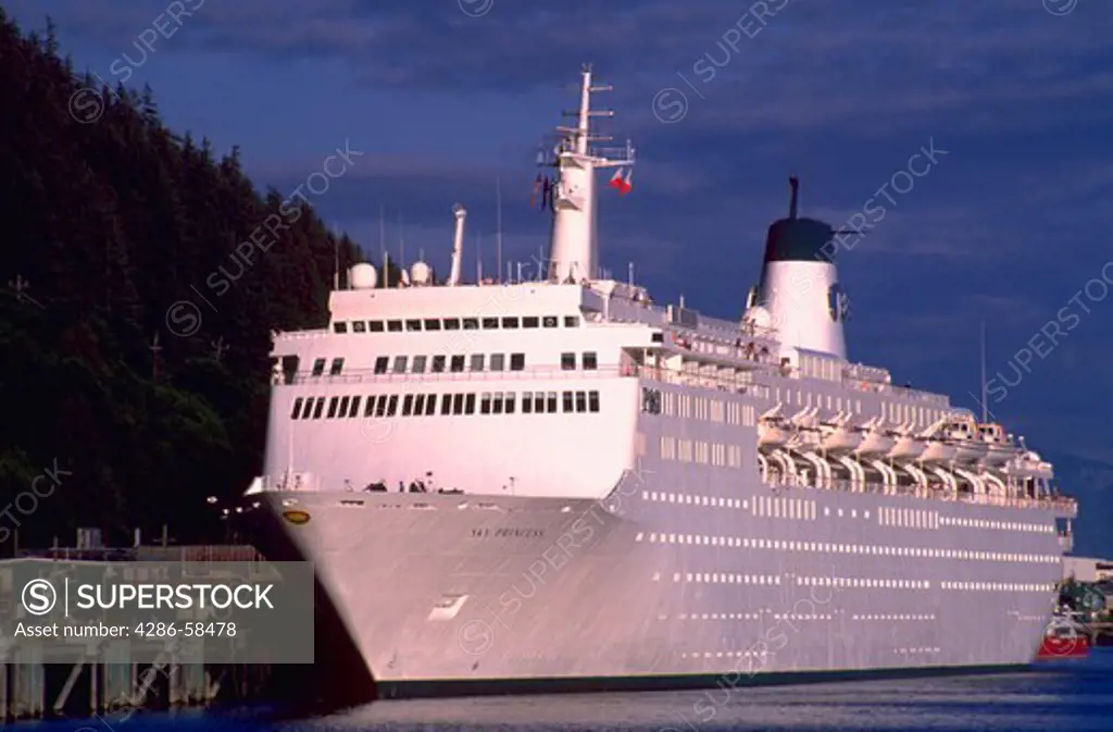 A large white cruise ship named the Sky Princess docked in Skagway, Alaska.