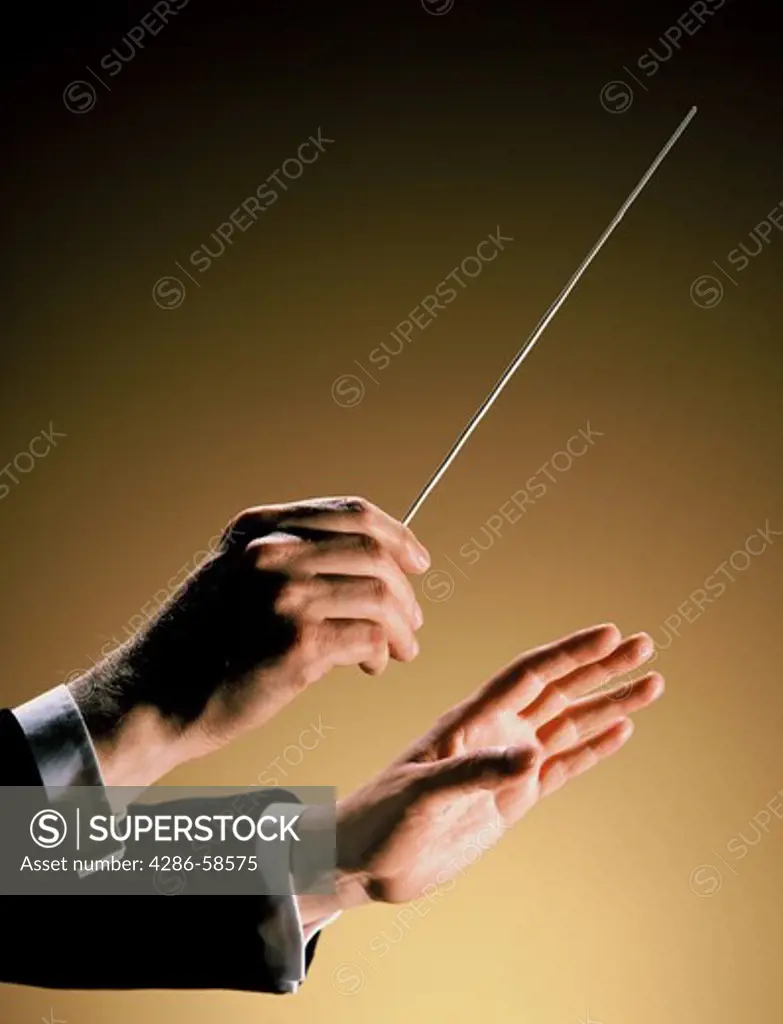 Orchestra conductor with baton.