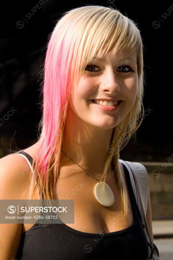 Beautiful modern blonde teenage girl on street in beautiful Edinburgh Scotland