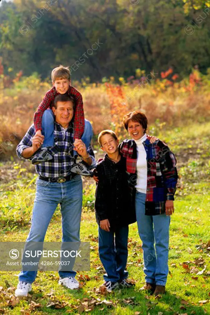 Children with Parents in Beautiful Fall Color Setting