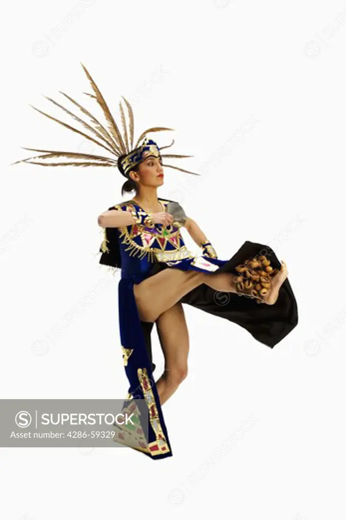 Aztec dancer wearing stage costume and performing