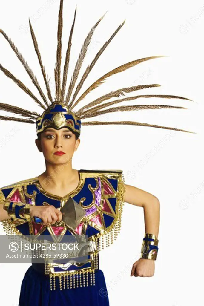 Portrait of an Aztec dancer wearing stage costume and performing