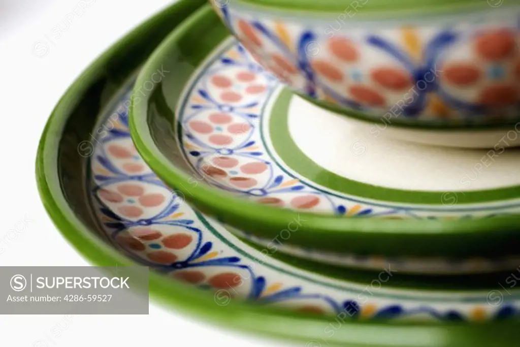 Close-up of plates and a bowl