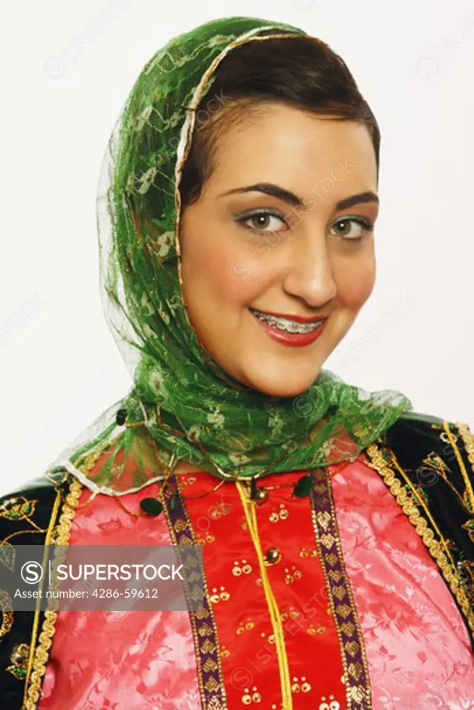 Portrait of a teenage girl smiling in traditional clothing