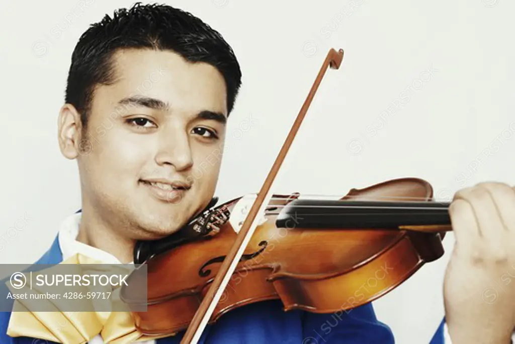 Portrait of a young man playing a violin