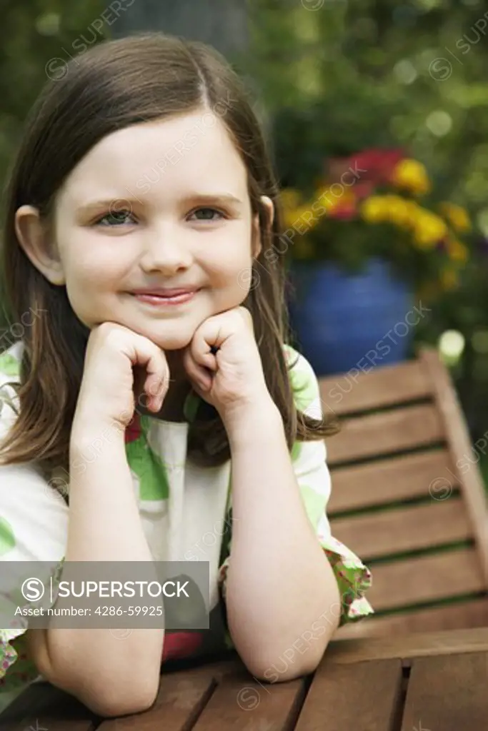 Girl leaning on her elbows and smiling
