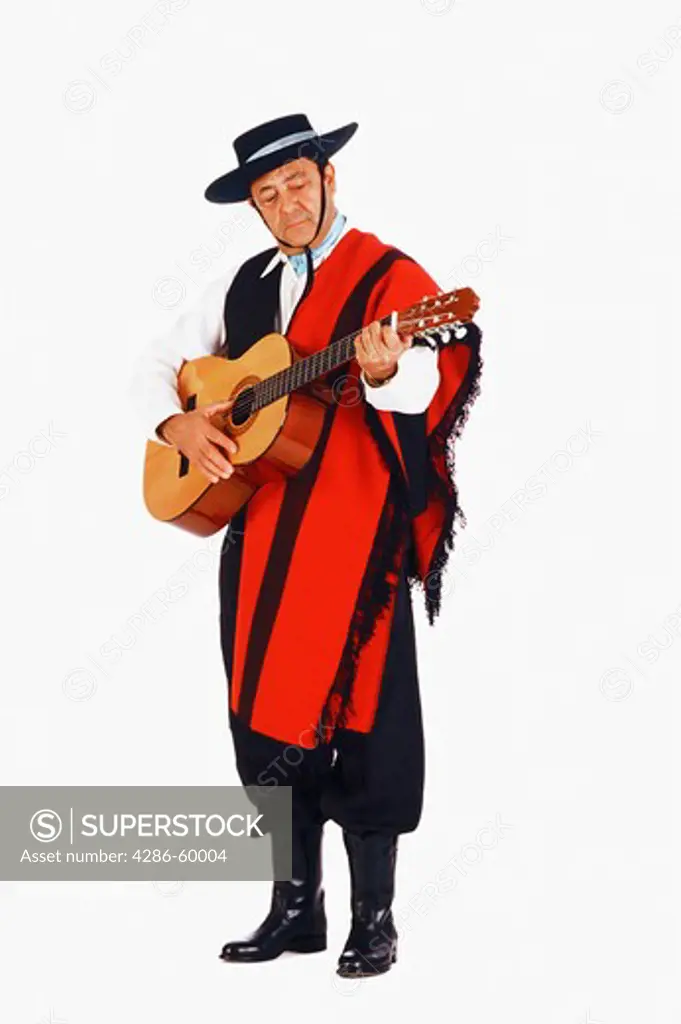 Mature man playing a guitar