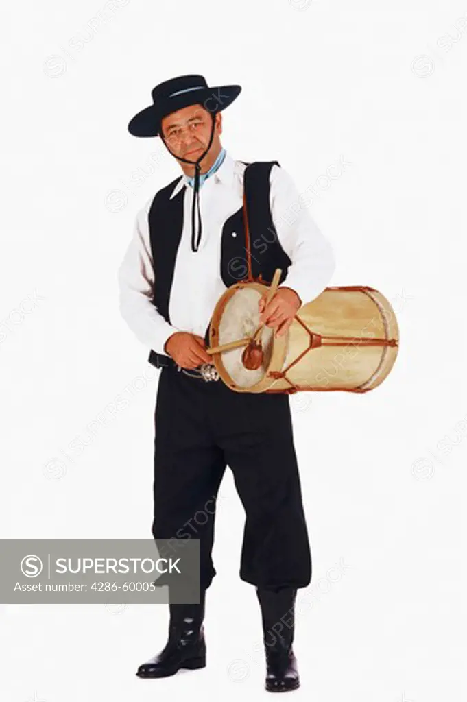 Portrait of a mature man playing a drum