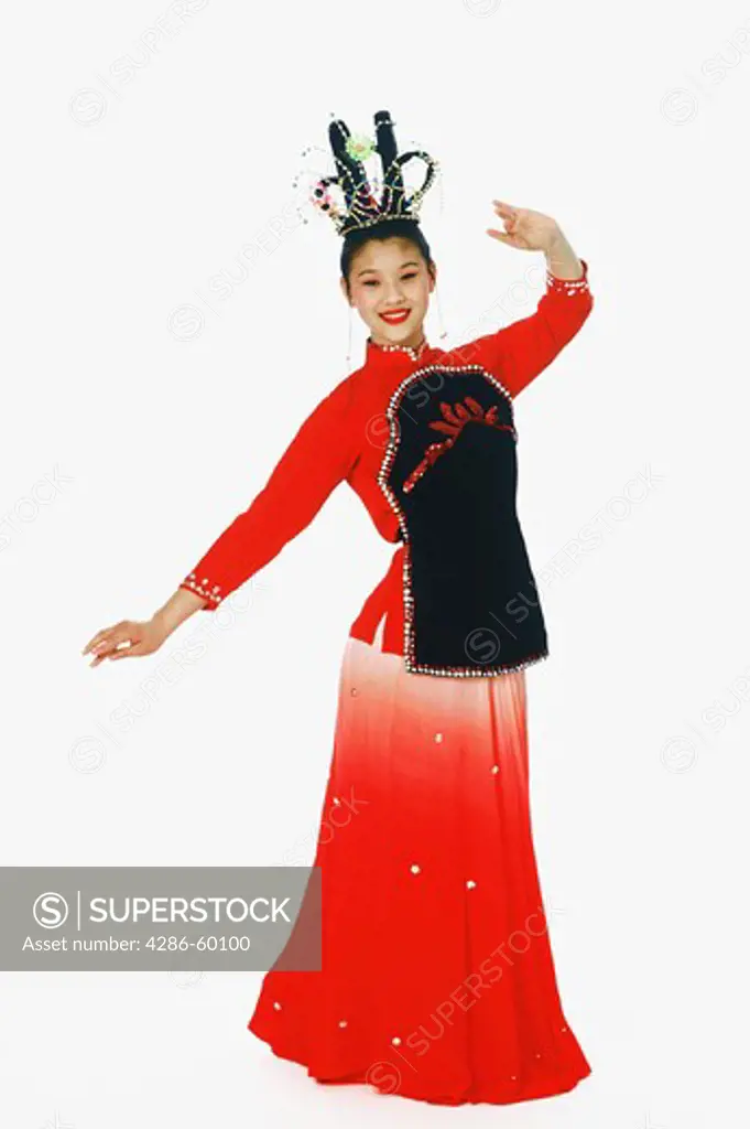 Portrait of a girl in traditional clothing and performing folk dance