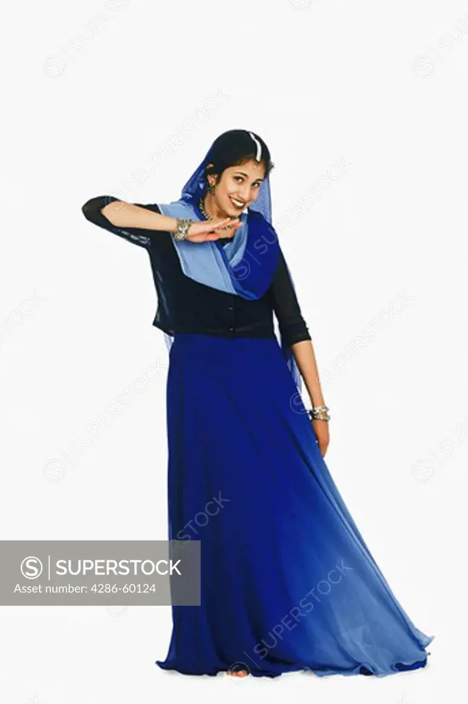 Portrait of a young woman performing folk dance