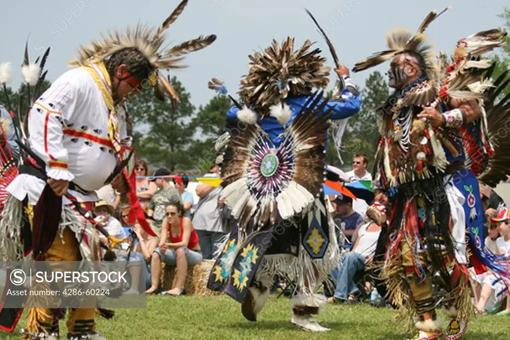 Charles Hankinson (Eagle Tail) (center), a Native American from the Micmac tribe of Canada, and Keith Anderson (right), his dancing brother, dance at the 8th Annual Redwing PowWow in Virginia Beach, Virginia. NOT MODEL RELEASED. EDITORIAL USE ONLY.