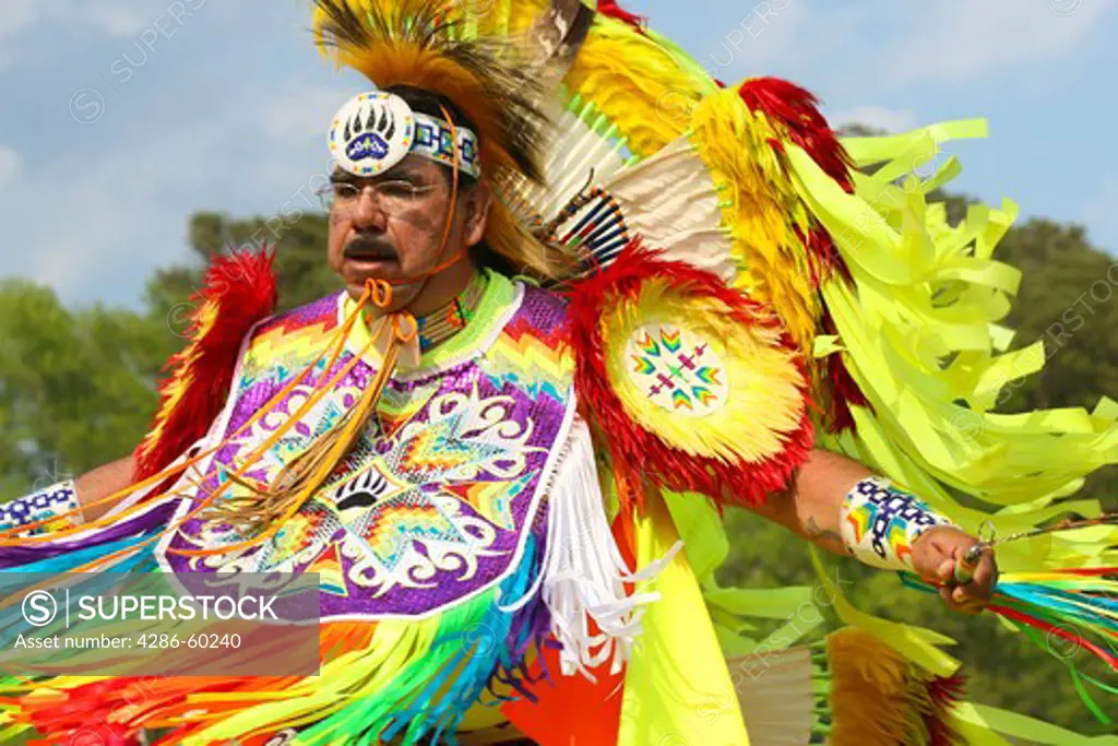 A Native American man dances in full traditional regalia at the 8th Annual Red Wing PowWow in Virginia Beach, Virginia. NOT MODEL RELEASED. EDITORIAL USE ONLY.