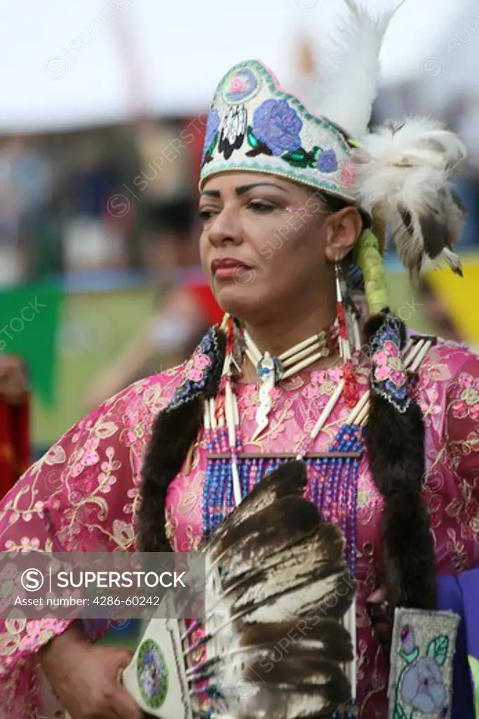 A Native American woman dances in full traditional regalia at the 8th Annual Red Wing PowWow in Virginia Beach, Virginia. NOT MODEL RELEASED. EDITORIAL USE ONLY.