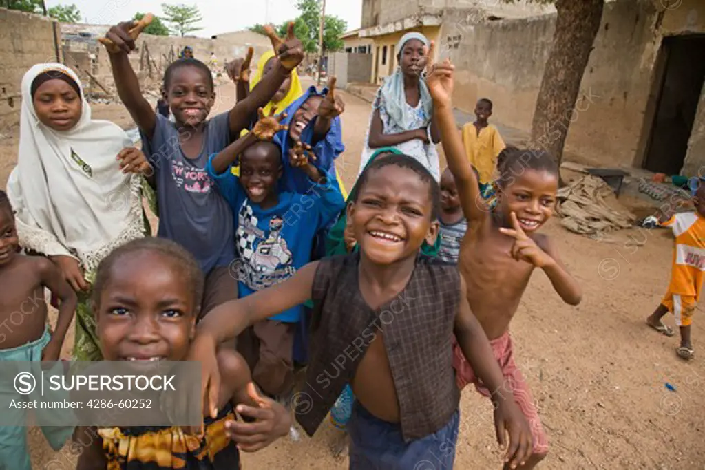 Children in Kano, Nigeria run toward the camera. NOT MODEL RELEASED. EDITORIAL USE ONLY.