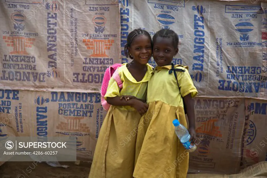Children walk home from school through the Durumi market area of Abuja, Nigeria. NOT MODEL RELEASED. EDITORIAL USE ONLY.