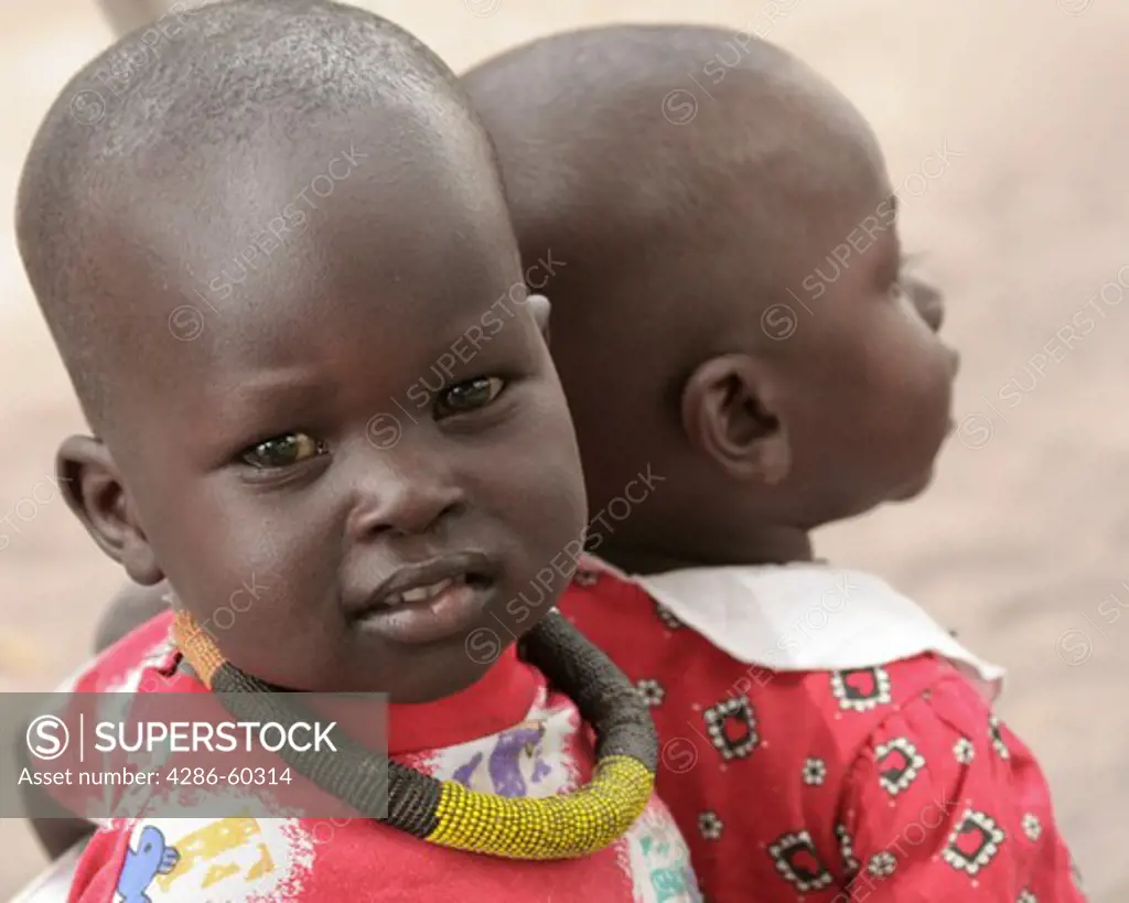 A child in Rumbek, South Sudan wears the traditional necklace of the Dinka ethnic group. NOT MODEL RELEASED. EDITORIAL USE ONLY.