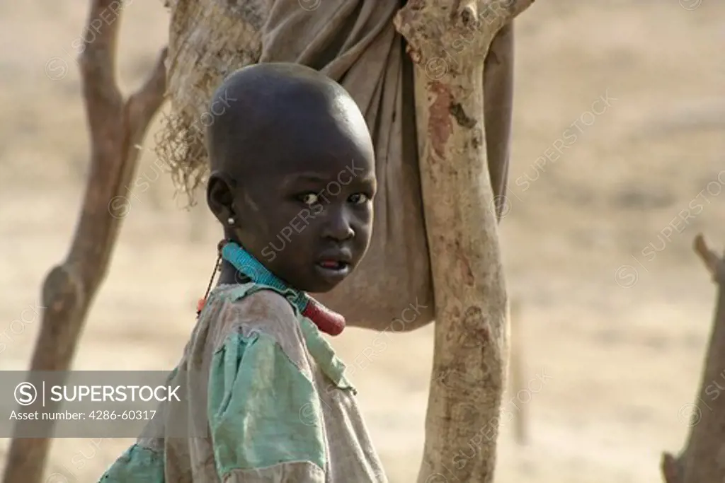 Dinka children grow up in a cattle camp near Akot, South Sudan.  South Sudan is still recovering from generations of civil war. NOT MODEL RELEASED. EDITORIAL USE ONLY.