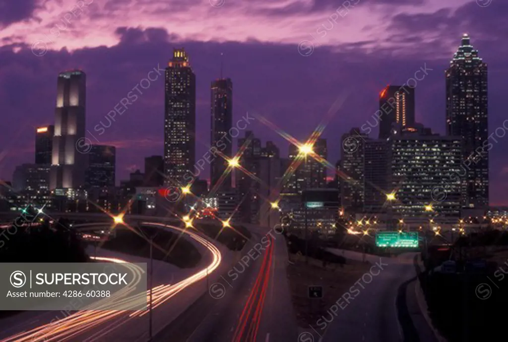 Atlanta, GA, Georgia, Downtown skyline, Freedom Parkway, evening, streaks of car lights along the expressway, road, transportation, traffic
