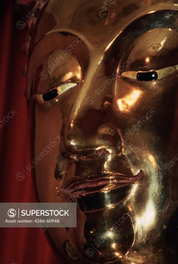 Close-up of a golden Buddha in Wat Traimit, Bangkok